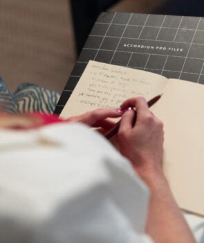 Author writes in notebook